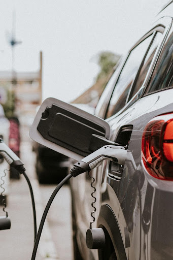 EV CHARGING STATION PLUGGED IN